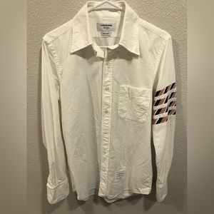 Thom browne shirt with stripes.